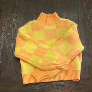 Yellow and orange checkered sweater